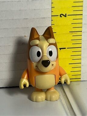 Orange Cartoon Dog Figurine 2”